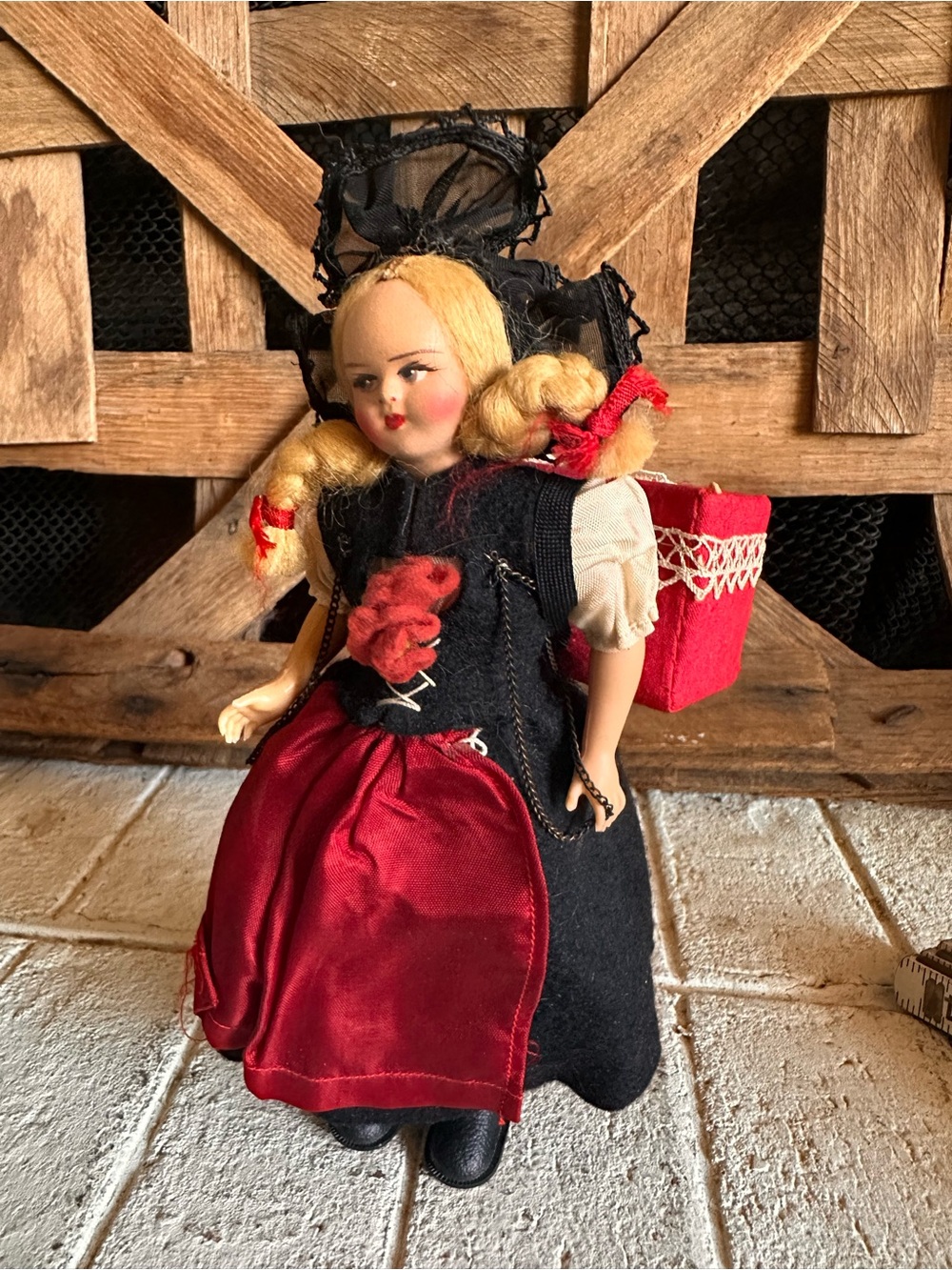 Vintage girl doll holding baby on back souvenir doll